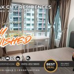 Fully furnished master bedroom at Razak City Residence showing North East podium view and study desk.